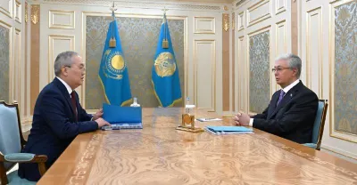 Миллиардные хищения, пирамиды и крипта: глава АФМ отчитался Токаеву